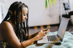 woman looking for a orthopedic surgeon on her phone and computer