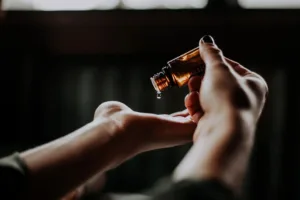 Woman using a skin care product prescribed by a dermatologist for acne treatment